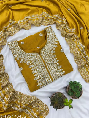 Women’s mustard yellow embroidered sharara suit set fabric detail