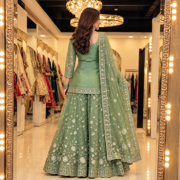 Back view of sage green embroidered three-piece ethnic set